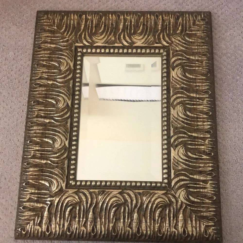 Wood framed mirror in gold